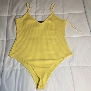 Primark. Yellow bodysuit. Size medium